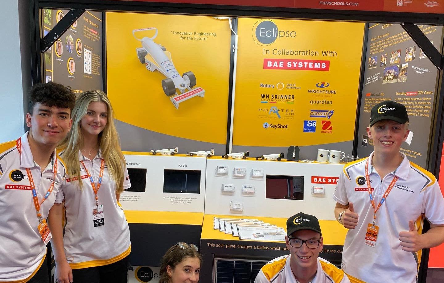 Team Eclipse in front of their pit display at the 2022 F1 in Schools World Finals.